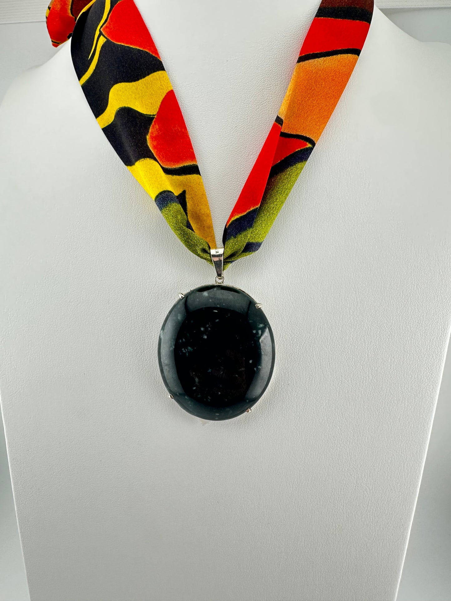 dark green translucent Jade framed pendant