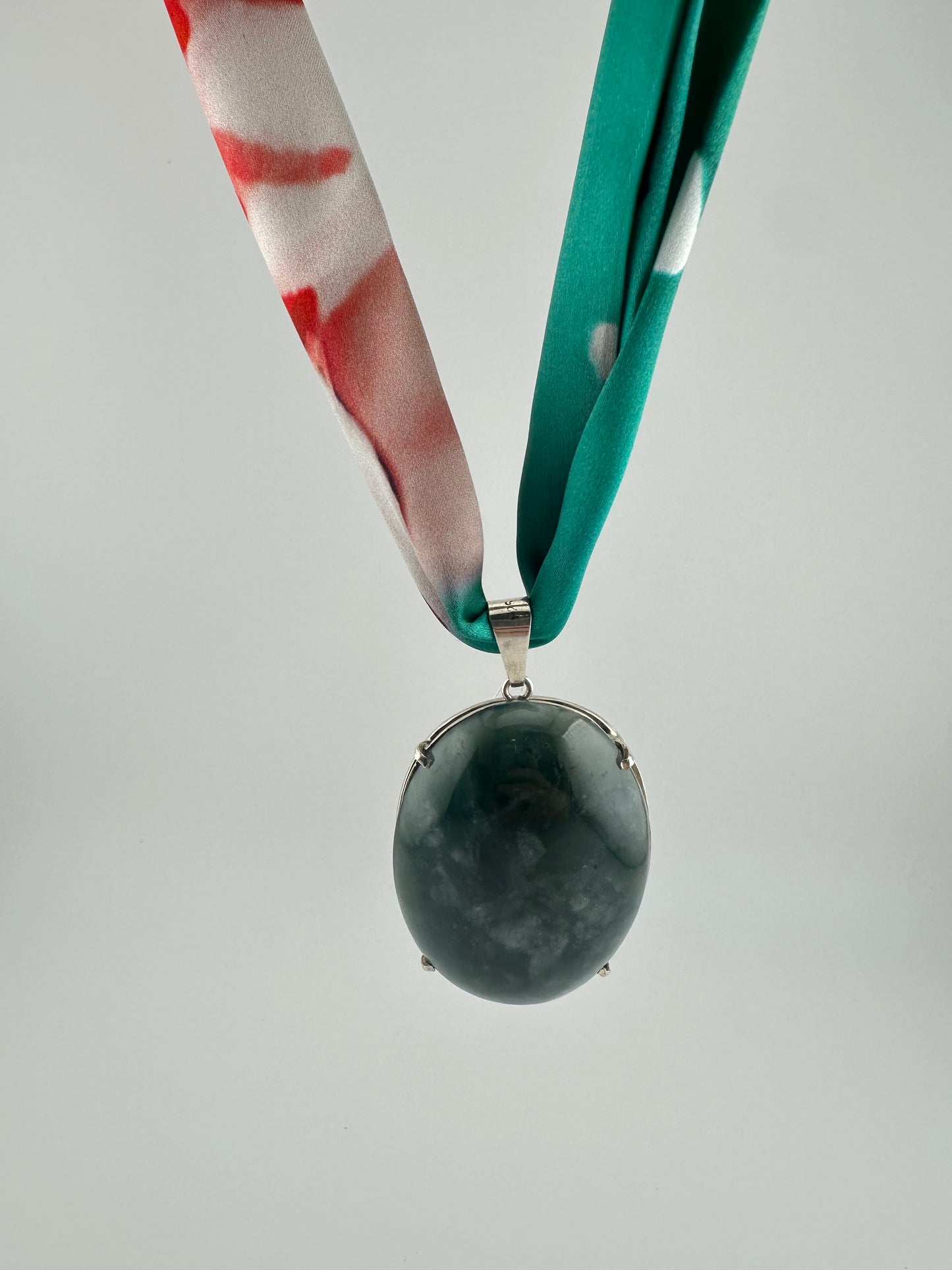 Translucent green oval framed Jade pendant