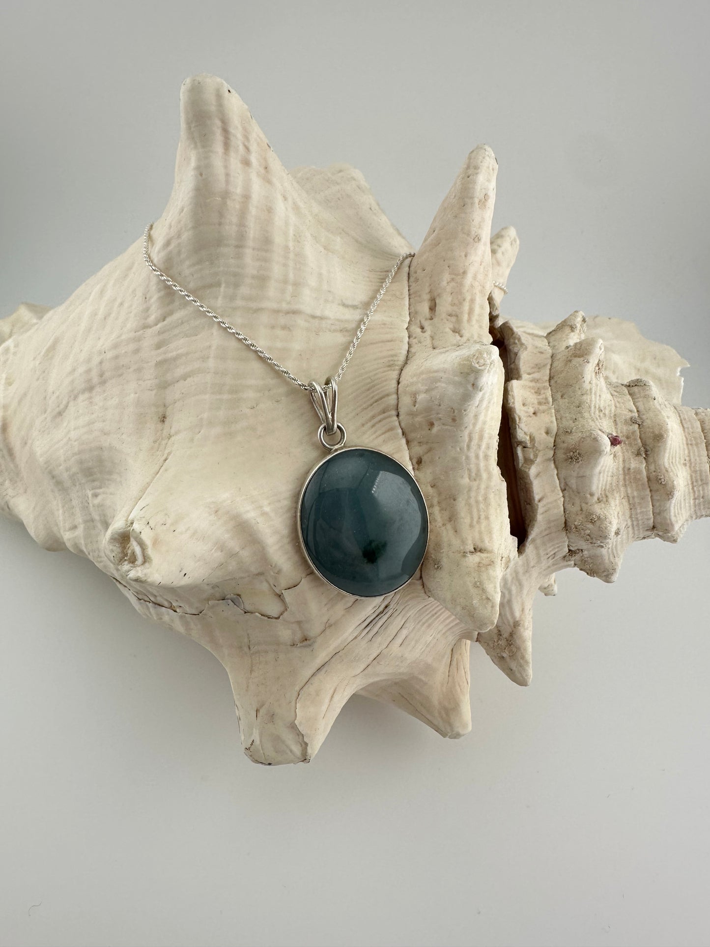 Grayed blue Jade circular pendant