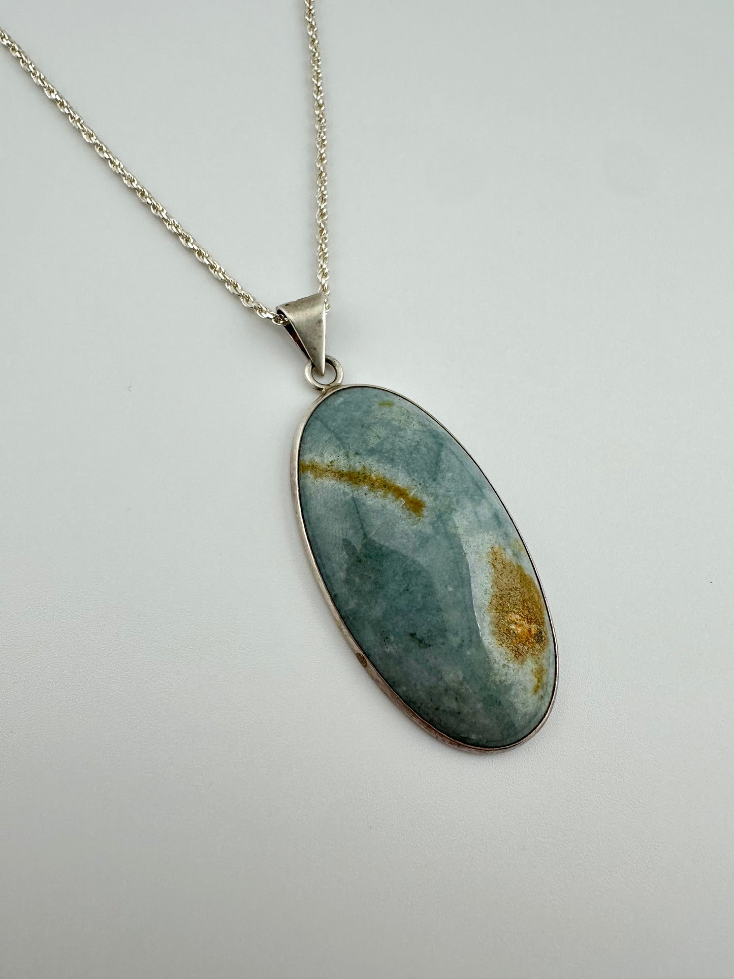 Blue fossilized Jade oval pendant