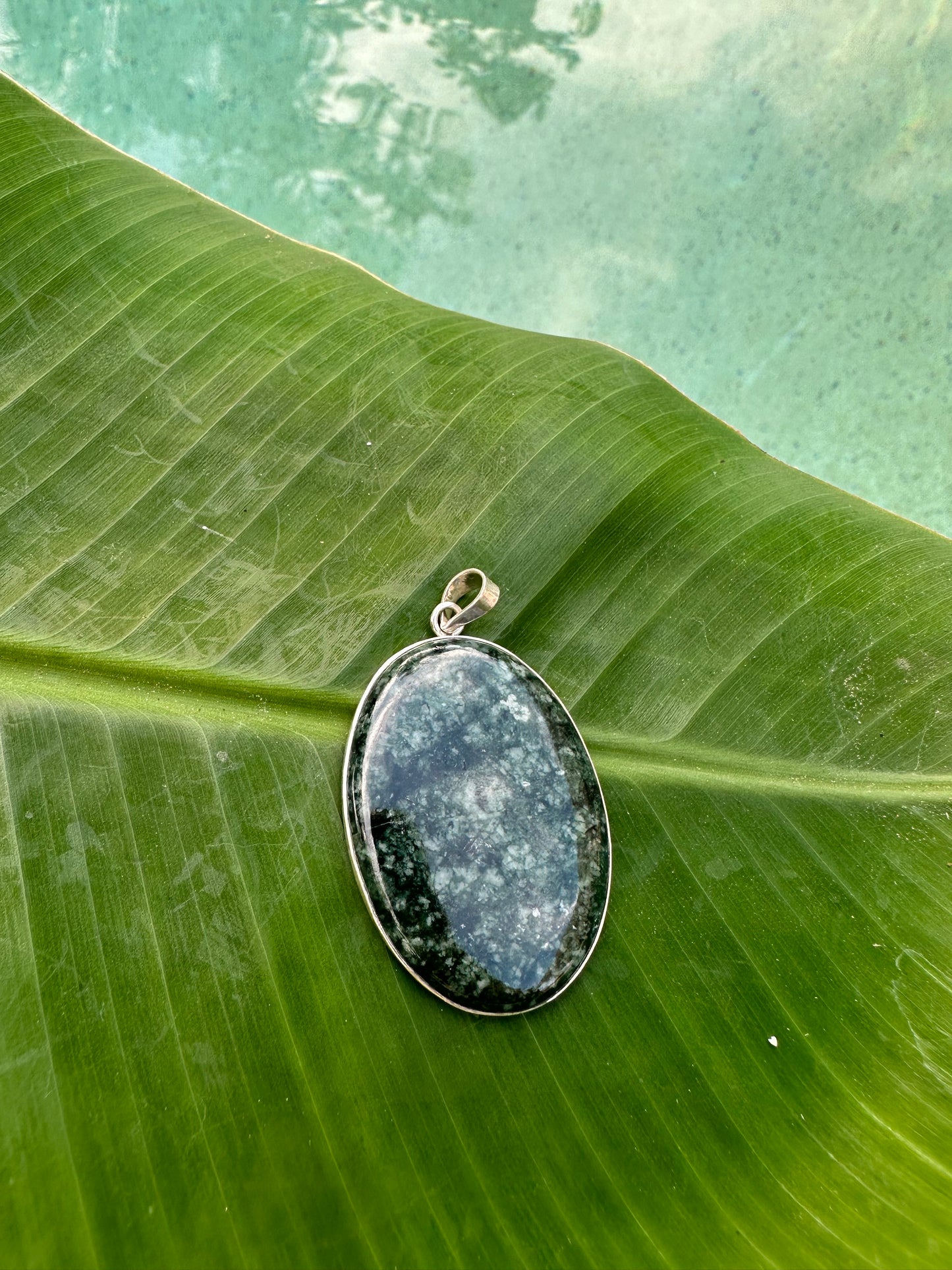 Spotted green jaguar Jade oval pendant