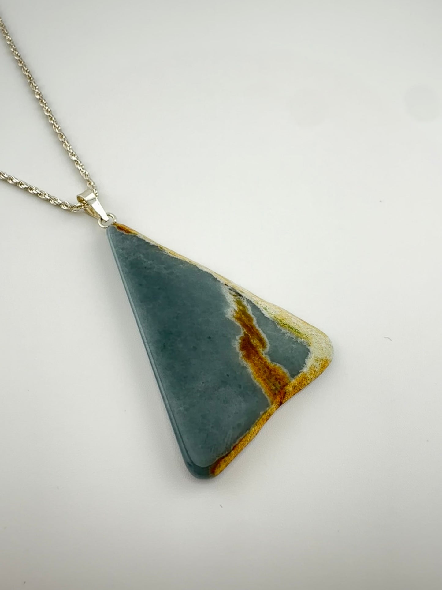 Blue fossilized Jade triangle pendant