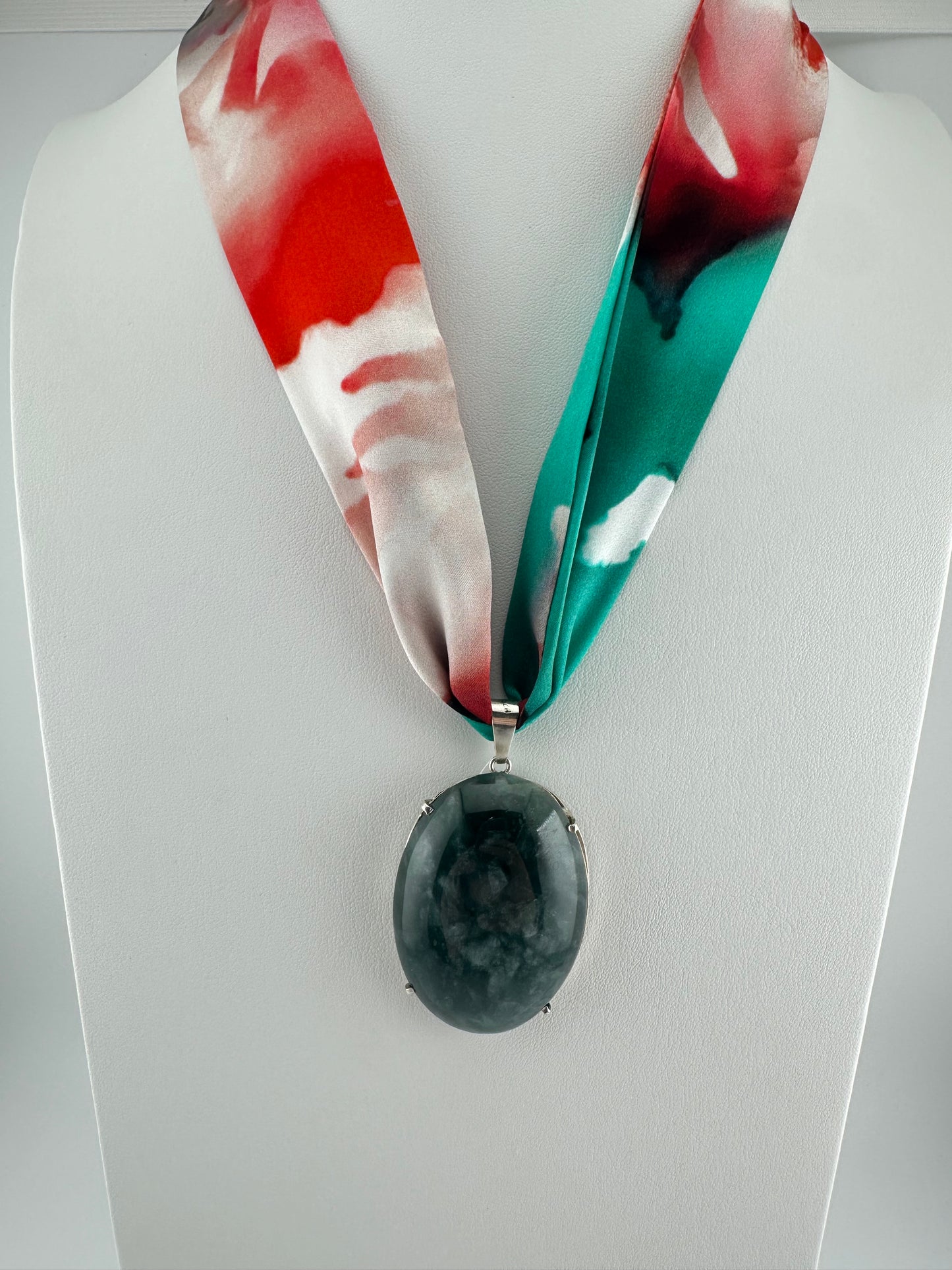 Translucent green oval framed Jade pendant